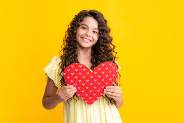 Happy teenager portrait. Happiness kids and love concept. Romantic lovely teen girl with red heart,...