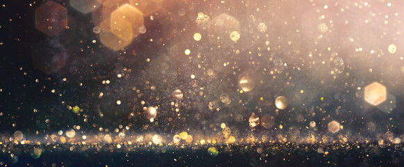 Abstract blurred glitter effects background. Brown and gold color