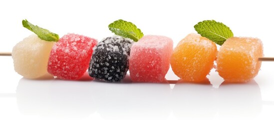 Fruit coated in sugar on sticks With copyspace for text