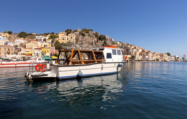 Colorful traditional fishing boats in the bay of Symi island.