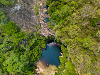 Fototapeta na wymiar Aerial view of the scenic waterfall Chorro San Luis embedded in a thick, tropical forest near Roboré in the lowlands of Bolivia - Traveling and exploring South America