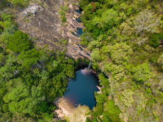Aerial view of the scenic waterfall Chorro San Luis embedded in a thick, tropical forest near Roboré in the lowlands of Bolivia - Traveling and exploring South America
