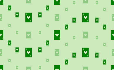 Seamless pattern of large and small green ace of heart cards. The elements are arranged in a wavy. Vector illustration on light green background