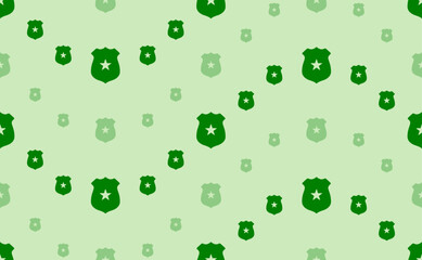 Seamless pattern of large and small green police badge symbols. The elements are arranged in a wavy. Vector illustration on light green background
