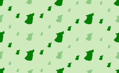 Seamless pattern of large and small green wolf head symbols. The elements are arranged in a wavy. Vector illustration on light green background