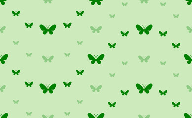 Seamless pattern of large and small green butterfly symbols. The elements are arranged in a wavy. Vector illustration on light green background