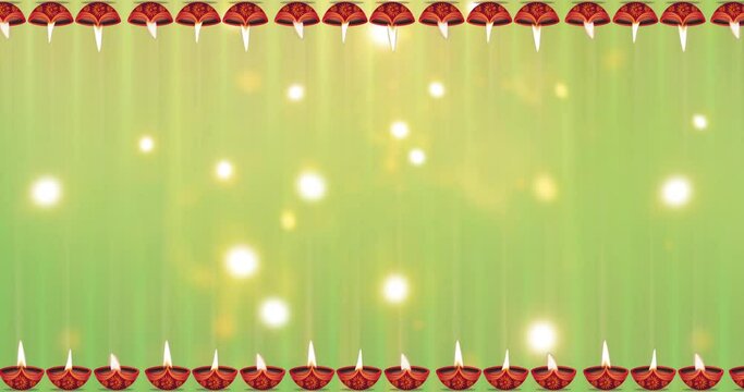 Happy Diwali motion graphic animation background with moving oil lamp and Exploding fireworks bokeh effect in the middle.