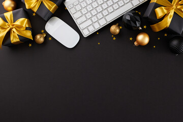 Scouring online stores for the perfect Christmas presents. Top view photo of keyboard, computer mouse, presents, black and golden xmas balls, stars confetti on black background with marketing spot