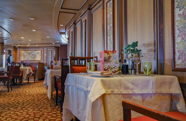 Elegant ocean view dining room a la carte restaurant onboard luxury cruiseship or cruise ship liner...
