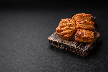 Delicious crispy mini puffs with sausage or meat with salt, thyme and sesame