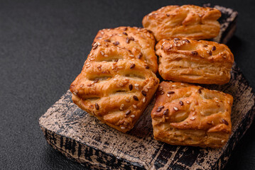 Delicious crispy mini puffs with sausage or meat with salt, thyme and sesame