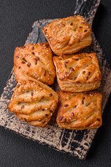 Delicious crispy mini puffs with sausage or meat with salt, thyme and sesame