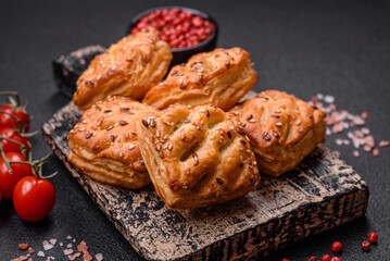 Delicious crispy mini puffs with sausage or meat with salt, thyme and sesame
