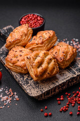 Delicious crispy mini puffs with sausage or meat with salt, thyme and sesame