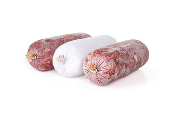 Isolated frozen meat sausages in a row. Raw food diet or barf for dogs, cats and pets. Organic human grade ground chicken and beef with muscle, bone and organs. White background. Selective focus.