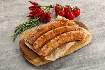 Raw sausages with spices and herbs