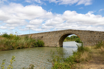 Fototapeta na wymiar Stone bridge over Canal du Midi, summer, France 