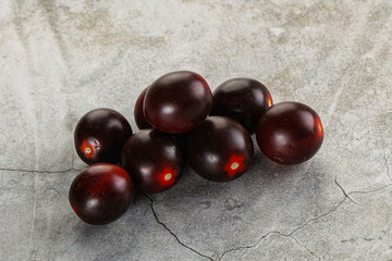 Raw ripe black kumato tomato