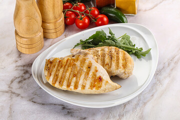 Grilled chicken breast served arugula