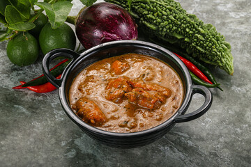 Indian cuisine - chicken curry with spices