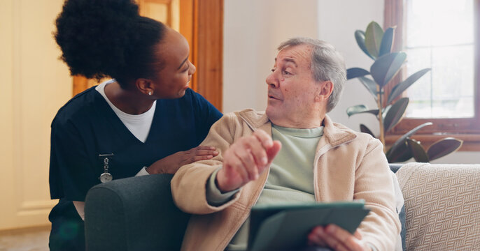 Tablet, Nurse And Senior Man On Sofa Browsing On Internet For Medical Consultation Research. Bonding, Healthcare And Black Woman Caregiver Talking To Elderly Patient Networking On Technology At Home.