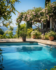 Swimming pool at home in a warm Mediterranean climate , outdoor pool with scattered shrubs and flowers around it