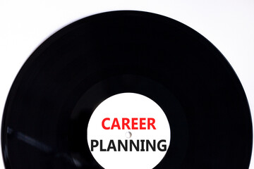 Career planning symbol. Concept words Career planning on beautiful black old retro vinyl disc. Beautiful white table white background. Business, motivational career planning concept. Copy space.