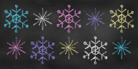 Set of Design Elements Snowflakes of Different Colors Isolated on Chalkboard Backdrop. Realistic Chalk Drawn Sketch.