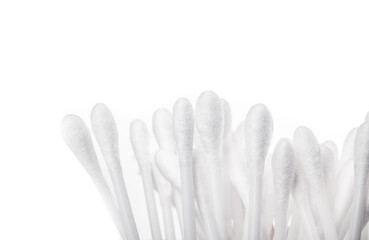 Isolated pile of cotton swabs or q tip. Used to clean ears, remove make-up, cleaning and arts and crafts. Selective focus. White background.
