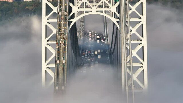 Rush Hour Traffic crossing New York's George Washington Bridge on a foggy autumn morning