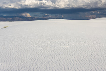 The Beautiful White Sands National Monument and Park in White Sands, New Mexico, near Alamogordo and Las Cruces, surrounded by threatening clouds in the late afternoon