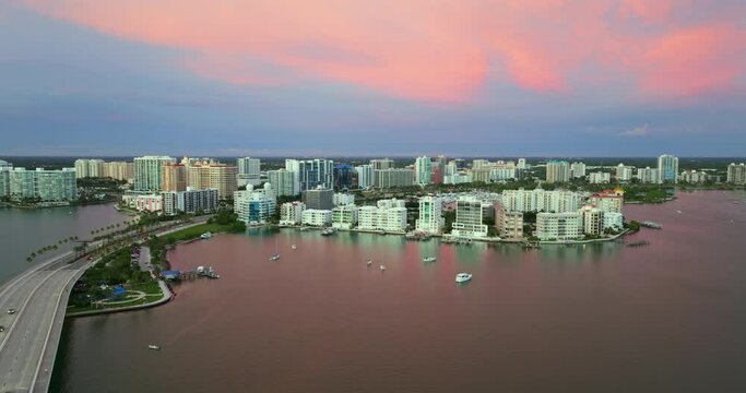 Florida travel destination at sunset. Sarasota city downtown with Ringling Bridge and expensive waterfront high-rise buildings