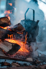 warming up teapot in fireflames.jpg