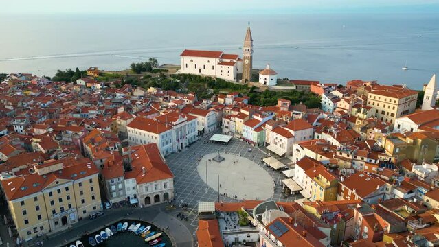 Aerial view of Piran town, St. George's Parish Church, Tartini main square, fishing port, Venetian architecture, Adriatic coastline, Mediterranean sunset, Slovenia