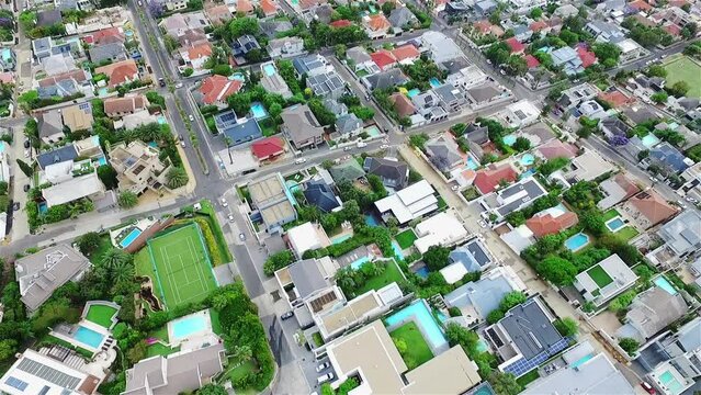 Aerial drone, city and road with architecture or traffic in urban settlement above houses or buildings. Top view of street, cityscape or town suburb, outdoor environment or industrial land structure