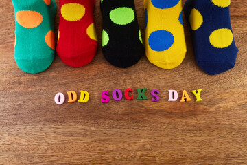 Odd Socks Day. Day lost socks, lonely socks on wooden background.