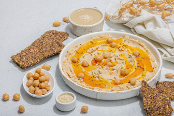 Hummus with olive oil, crispy bread. Indispensable for healthy lifestyle. Comfort food, vegan snack