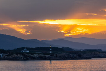 The sunsets in the Ria del Eo, from the Asturian side with the sun setting on Illa Pancha, are...