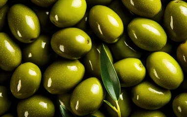 Zelfklevend Fotobehang Background of green olives close-up. raw materials for the production of olive oil. Greek olives. © Olga