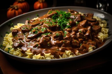 A delicious plate of pasta topped with savory mushrooms and rich gravy. Perfect for a comforting meal. Can be used in food blogs, recipe websites, or restaurant promotions.
