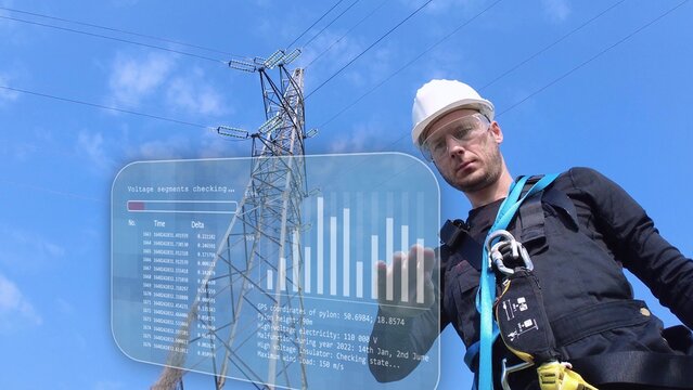 Electrical Engineer Working On A Holographic Screen, Doing Regular Pylon Safety Check Against Blue Sky. low angle