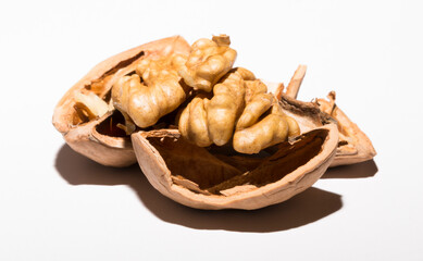 Walnuts are rounded, single-seeded stone fruits of the walnut tree. Cracking a nut.