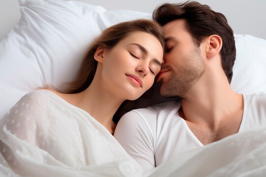 Man and woman top view sleeping together peacefully in the bed
