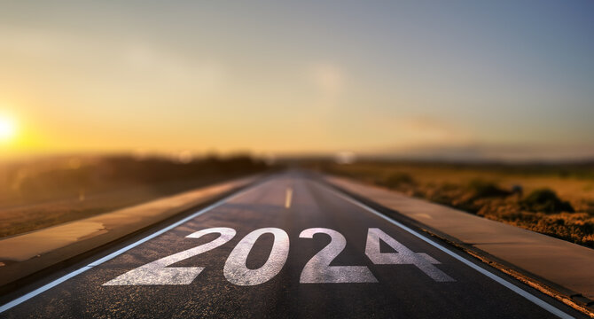 empty street with the new year 2024 written on the road - concept of setting goals for the next year