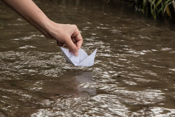 Paper boat on the river