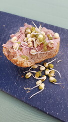 liver sausage as bread roll spread with mung bean,