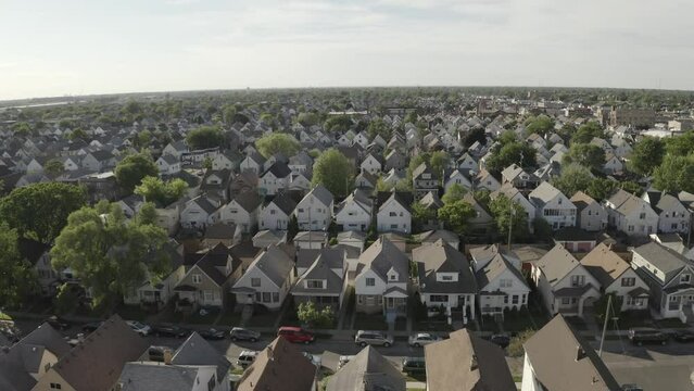 Drone view of Urban Neighborhood with Rows of Family Homes