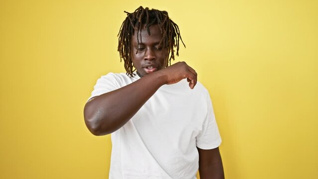 African American Man Sneezing Over Isolated Yellow Background