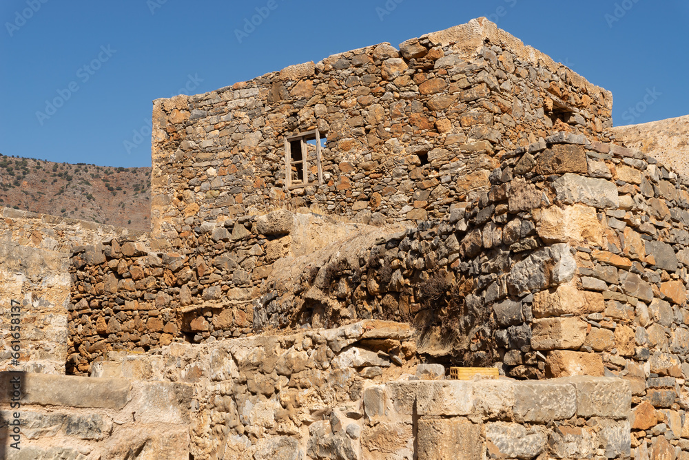 Wall mural ruins of houses.