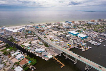 Fototapeta premium Fort Myers Beach Florida after hurricane. Houses, hotels flooded and destroyed on the beach. Hurricane season is dangerous. Tropical nature. Gulf of Mexico. Ian or Idalia. Tropical storm.